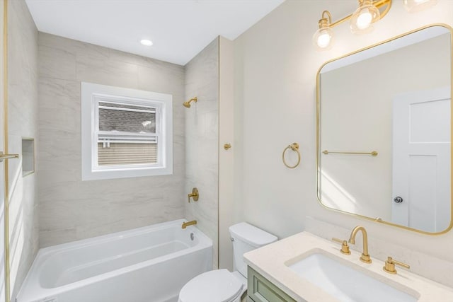 bathroom featuring shower / tub combination, vanity, and toilet