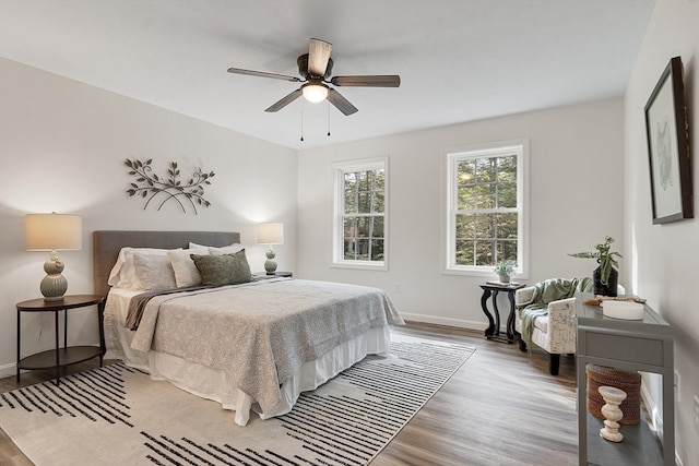 bedroom featuring ceiling fan and light hardwood / wood-style flooring