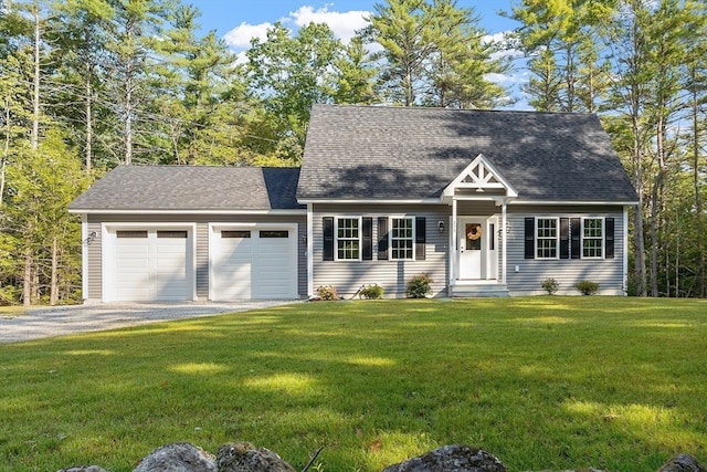 new england style home with a front yard and a garage