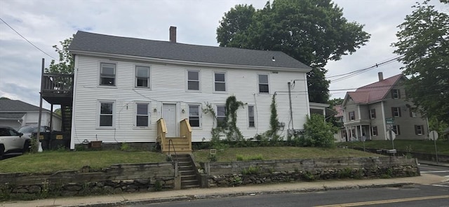 51 Pleasant St, Ware, MA 01082 - view of front of house with entry steps, a chimney, and a front lawn