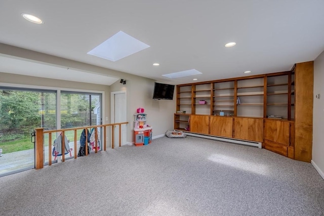 9 Brucewood, Acton, MA 01720 - recreation room with a skylight, carpet floors, a baseboard radiator, baseboards, and recessed lighting