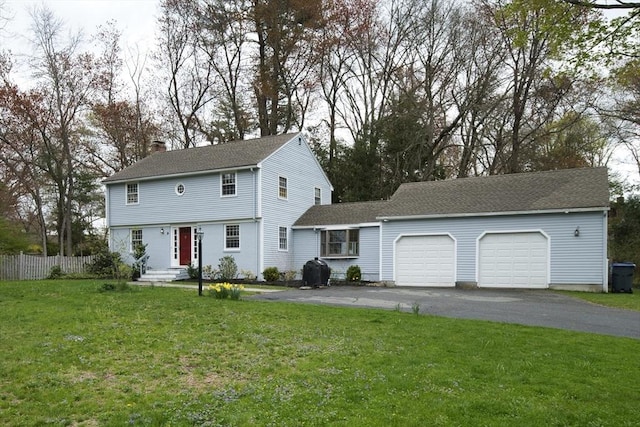 9 Brucewood, Acton, MA 01720 - colonial inspired home featuring fence, aphalt driveway, a garage, a front yard, and a chimney