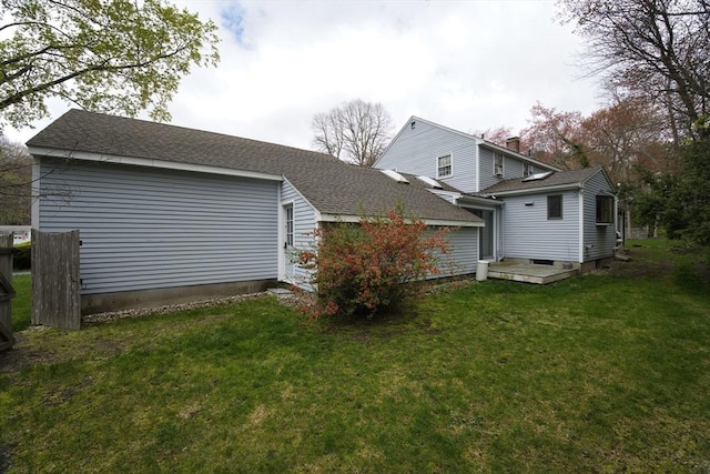 9 Brucewood, Acton, MA 01720 - back of house with roof with shingles and a yard