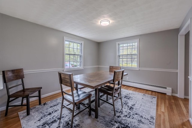 9 Brucewood, Acton, MA 01720 - dining room with plenty of natural light, baseboard heating, and wood finished floors