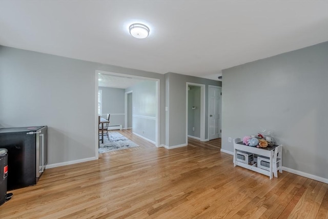 9 Brucewood, Acton, MA 01720 - interior space featuring light wood-style floors, a wood stove, and baseboards