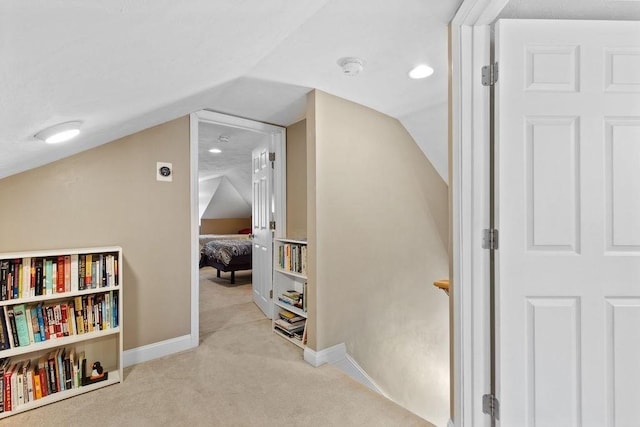 bonus room with carpet floors, baseboards, and lofted ceiling