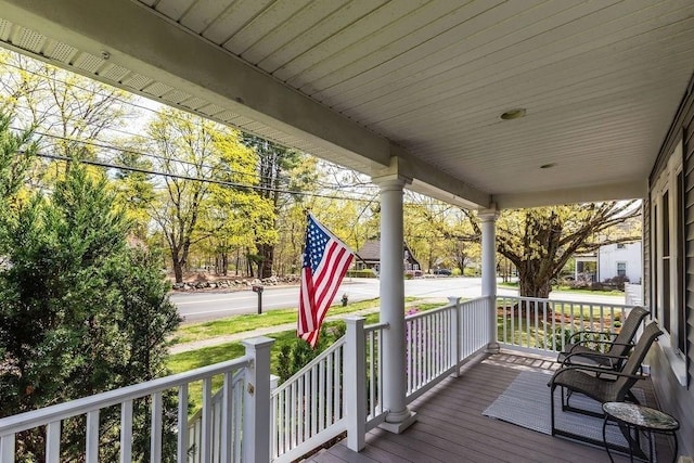 wooden terrace with a porch