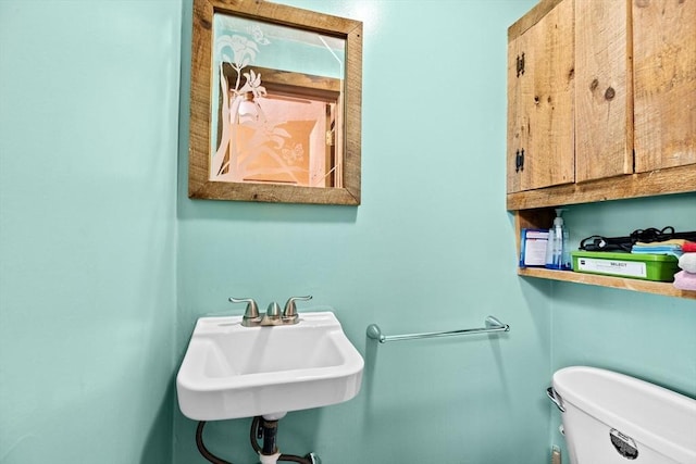 bathroom featuring sink and toilet