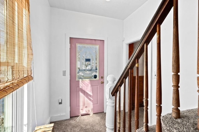 view of carpeted entrance foyer