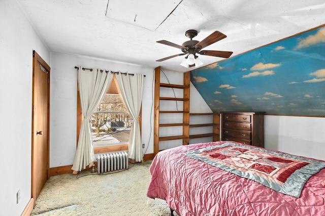 bedroom featuring radiator, vaulted ceiling, ceiling fan, and carpet