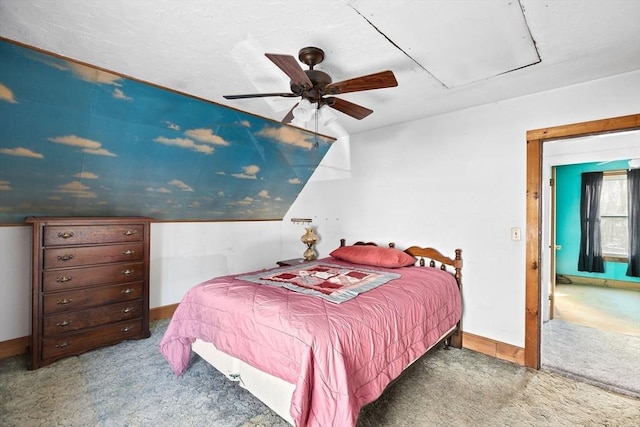 bedroom featuring light colored carpet and ceiling fan