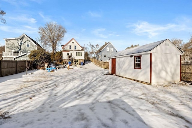 back of property featuring an outbuilding