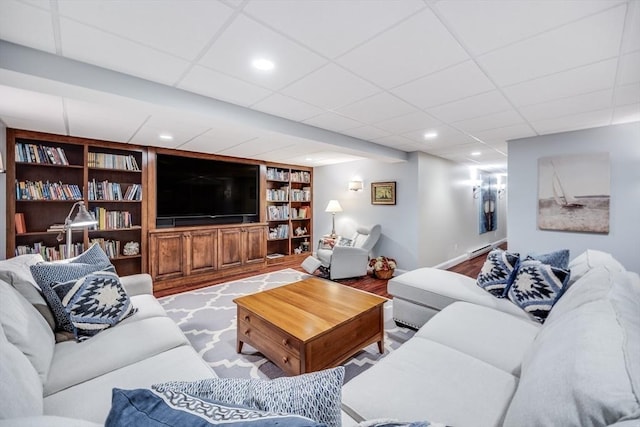 11 Teal Cir, Mashpee, MA 02649 - living room featuring built in features, wood finished floors, a drop ceiling, and recessed lighting