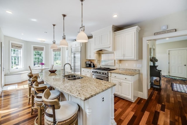 11 Teal Cir, Mashpee, MA 02649 - kitchen with premium appliances, dark wood finished floors, white cabinets, light stone counters, and recessed lighting