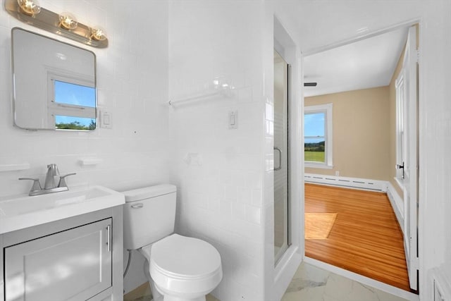 bathroom with a stall shower, toilet, marble finish floor, baseboard heating, and vanity