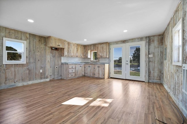 kitchen featuring light wood finished floors, french doors, backsplash, and recessed lighting