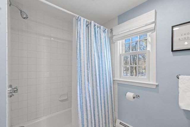 bathroom with a baseboard radiator and shower / tub combo