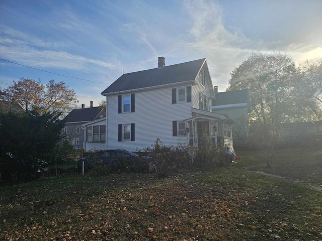 view of home's exterior featuring a chimney