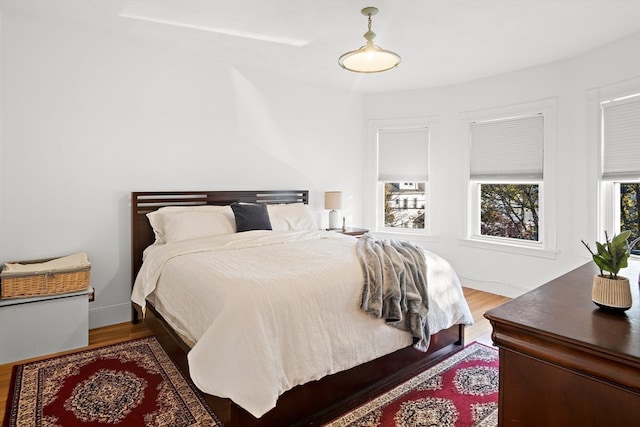 bedroom with hardwood / wood-style flooring