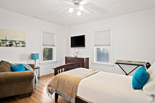 bedroom featuring ceiling fan and light hardwood / wood-style floors