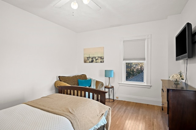 bedroom featuring ceiling fan and light hardwood / wood-style flooring