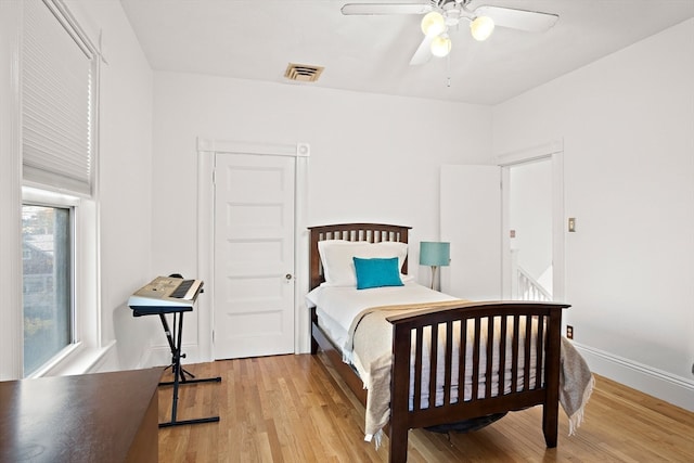 bedroom featuring ceiling fan and light hardwood / wood-style flooring