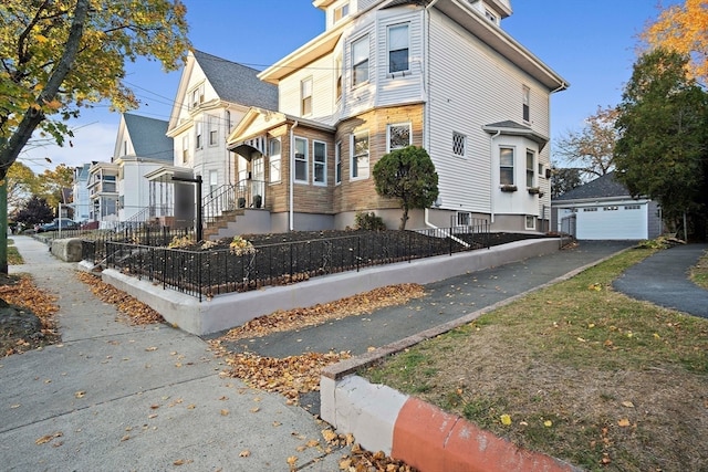 view of home's exterior featuring a garage and an outdoor structure