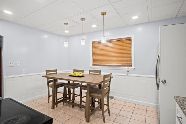 dining area featuring light tile patterned flooring