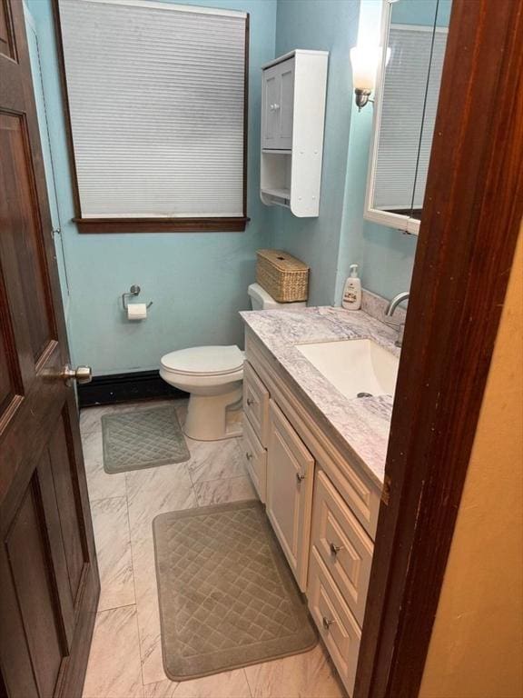 bathroom with toilet and vanity