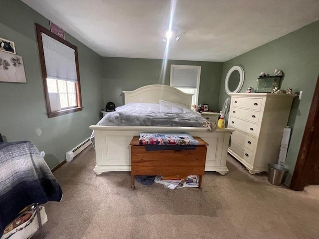 carpeted bedroom with baseboard heating