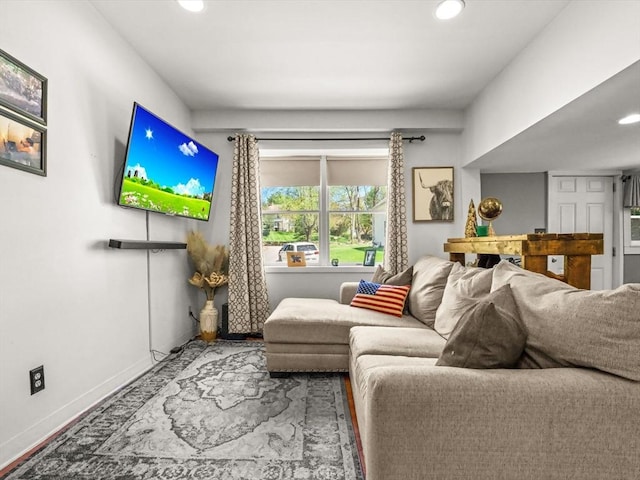 living room with recessed lighting and baseboards