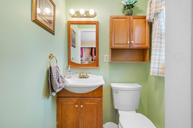 half bath with vanity and toilet