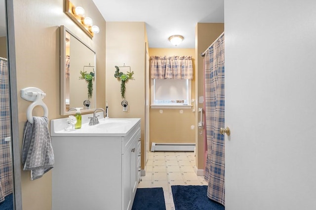 bathroom featuring baseboard heating, vanity, and tile patterned floors