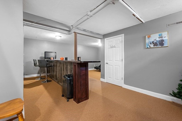 home office with visible vents and baseboards