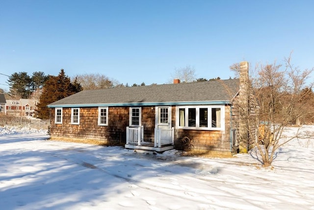 view of front of house with a shingled roof