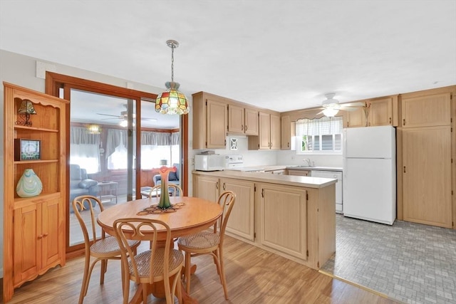 76 Regal St, Springfield, MA 01118 - kitchen with white appliances, a ceiling fan, a sink, and light countertops
