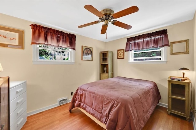 76 Regal St, Springfield, MA 01118 - bedroom featuring multiple windows, baseboards, and wood finished floors