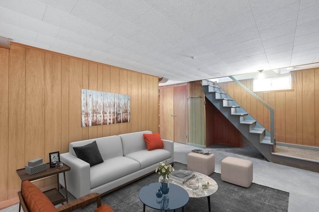 76 Regal St, Springfield, MA 01118 - living room with wooden walls and stairway
