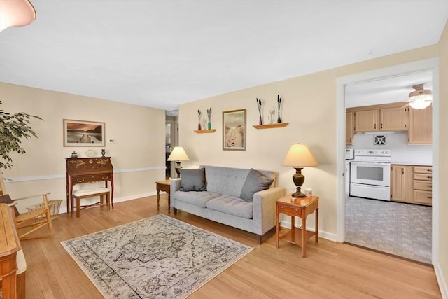 76 Regal St, Springfield, MA 01118 - living room featuring light wood-style floors, baseboards, and ceiling fan