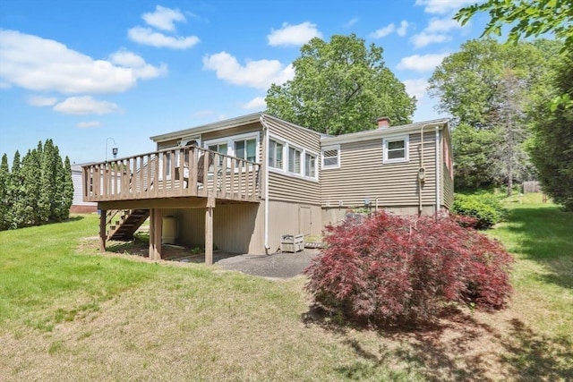 76 Regal St, Springfield, MA 01118 - rear view of house featuring stairway, a wooden deck, and a yard