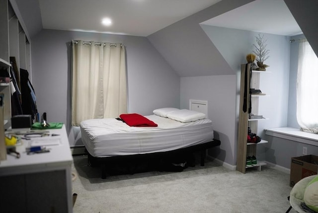 bedroom with lofted ceiling, a baseboard radiator, baseboards, and light colored carpet