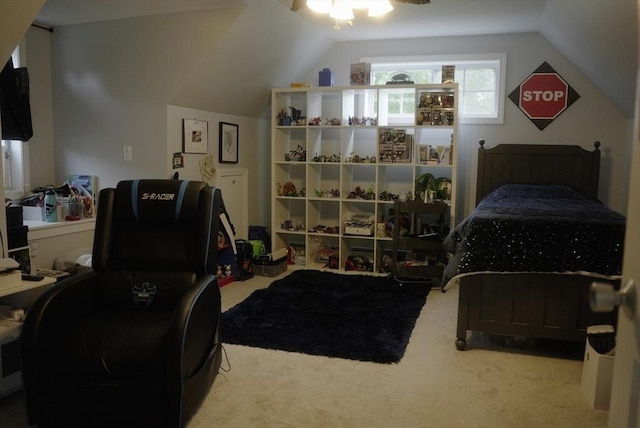 bedroom featuring a ceiling fan, carpet, and lofted ceiling