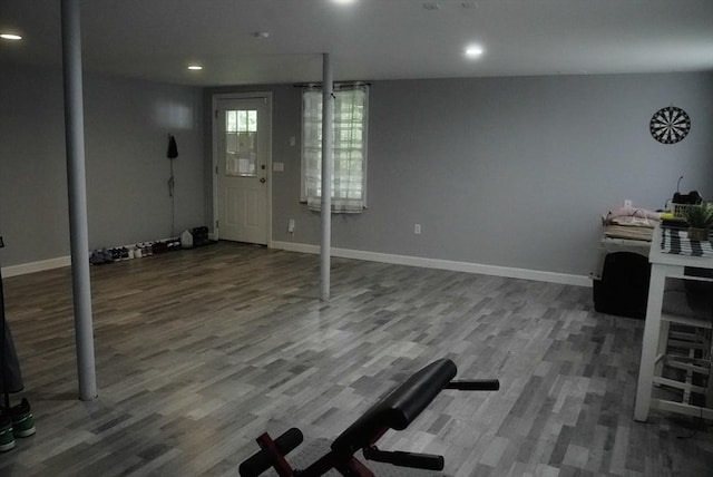 interior space featuring baseboards, wood finished floors, and recessed lighting