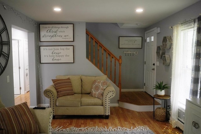 interior space with stairs, baseboards, wood finished floors, and recessed lighting