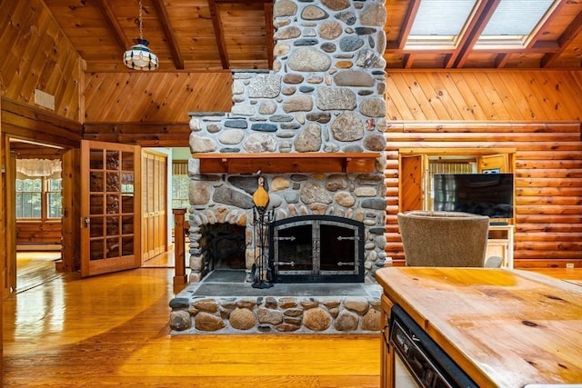 7 Hawthorne Dr, Southampton, MA 01073 - living area with a wooden ceiling with exposed beams, a fireplace, wood-type flooring, wooden walls, and a baseboard radiator