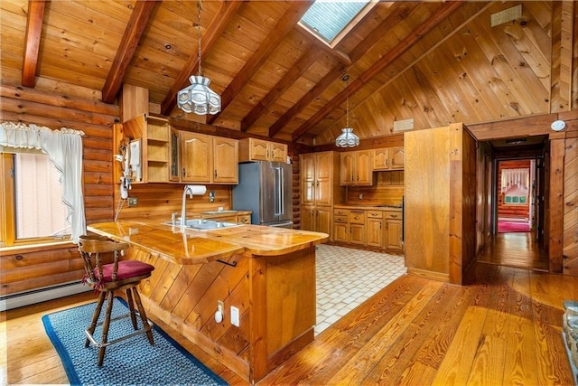 7 Hawthorne Dr, Southampton, MA 01073 - kitchen with high end refrigerator, a peninsula, open shelves, high vaulted ceiling, and a wood ceiling with exposed beams