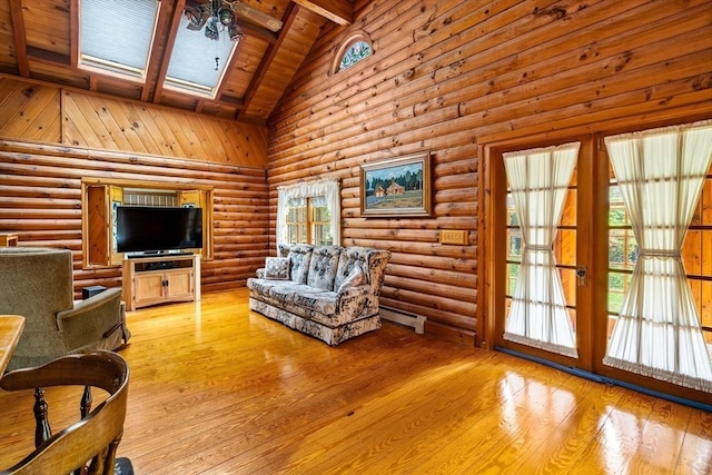 7 Hawthorne Dr, Southampton, MA 01073 - living area with high vaulted ceiling, a skylight, a wooden ceiling with exposed beams, healthy amount of natural light, and light wood-type flooring