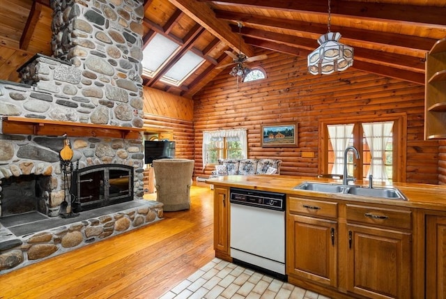 7 Hawthorne Dr, Southampton, MA 01073 - kitchen with a stone fireplace, white dishwasher, high vaulted ceiling, open floor plan, and a skylight