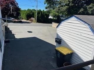 exterior space with a storage shed