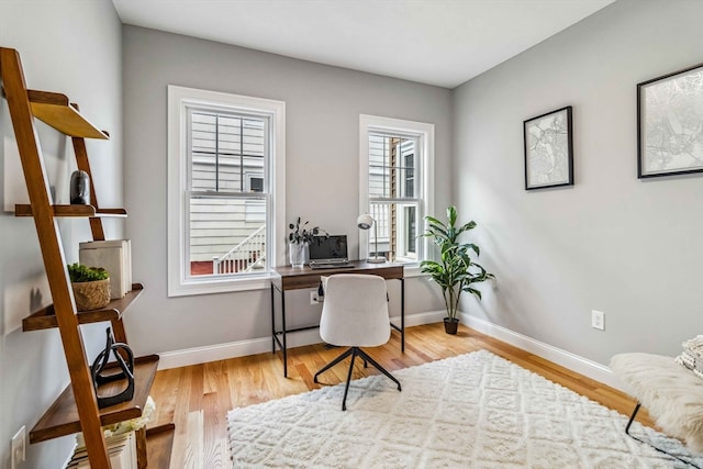 office space with light wood-type flooring